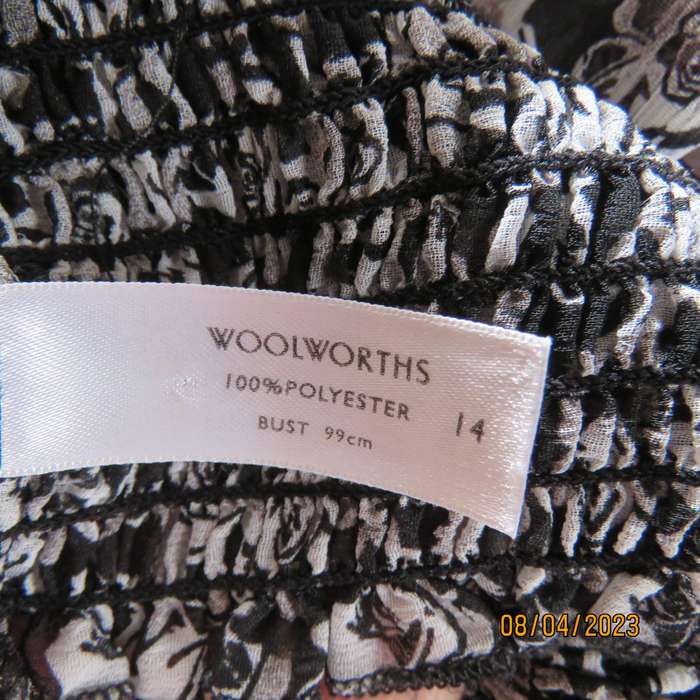 WOOLWORTHS black-white floral sheer polyester top. Wide short cut-on sleeves. Size 38