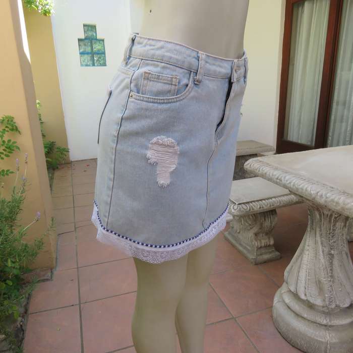 Sexy light blue denim jean distressed look  skirt. Pencil style. Decorative hem. Size 32. As new con