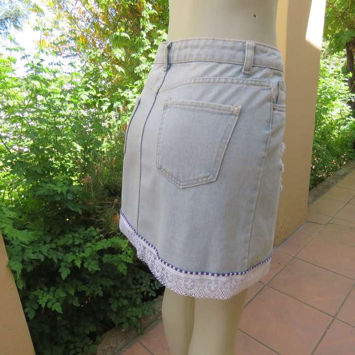 Sexy light blue denim jean distressed look  skirt. Pencil style. Decorative hem. Size 32. As new con