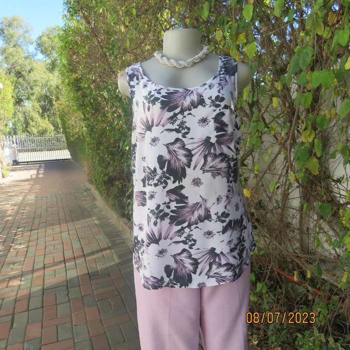 MILADYS white viscose sleeveless slip over top. Bold lilac-black flowers. Size 34