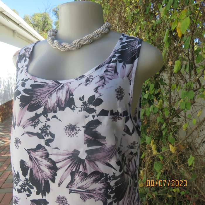MILADYS white viscose sleeveless slip over top. Bold lilac-black flowers. Size 34
