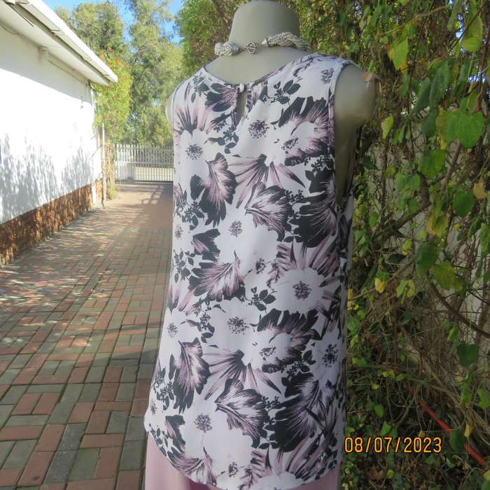 MILADYS white viscose sleeveless slip over top. Bold lilac-black flowers. Size 34