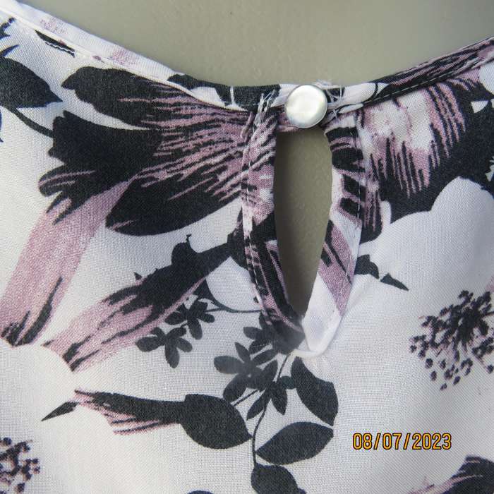 MILADYS white viscose sleeveless slip over top. Bold lilac-black flowers. Size 34