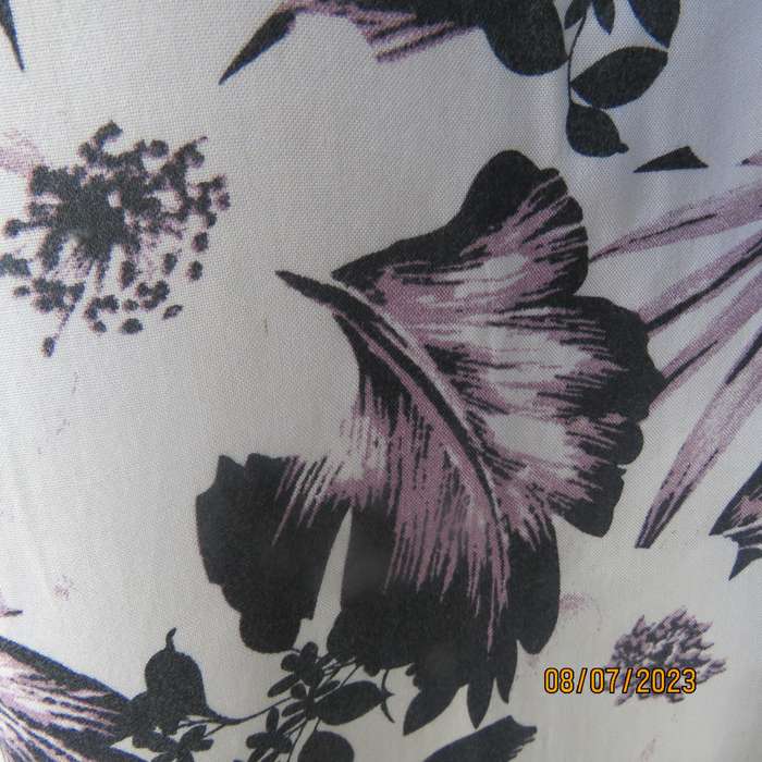 MILADYS white viscose sleeveless slip over top. Bold lilac-black flowers. Size 34