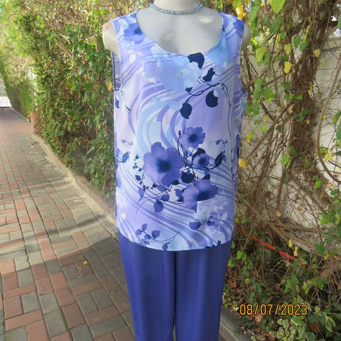 Boutique made sleeveless polyester top in medley of blue colours. Size 36