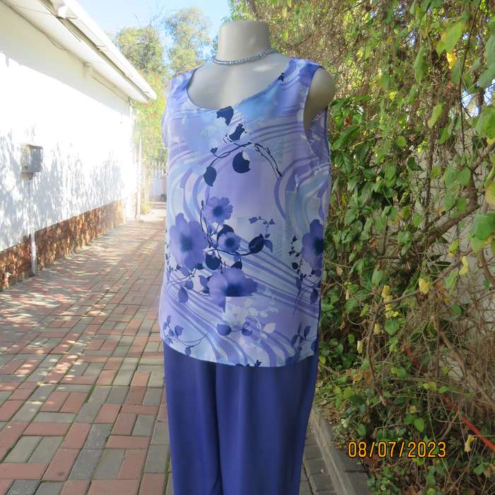 Boutique made sleeveless polyester top in medley of blue colours. Size 36