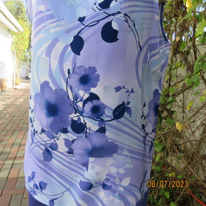 Boutique made sleeveless polyester top in medley of blue colours. Size 36