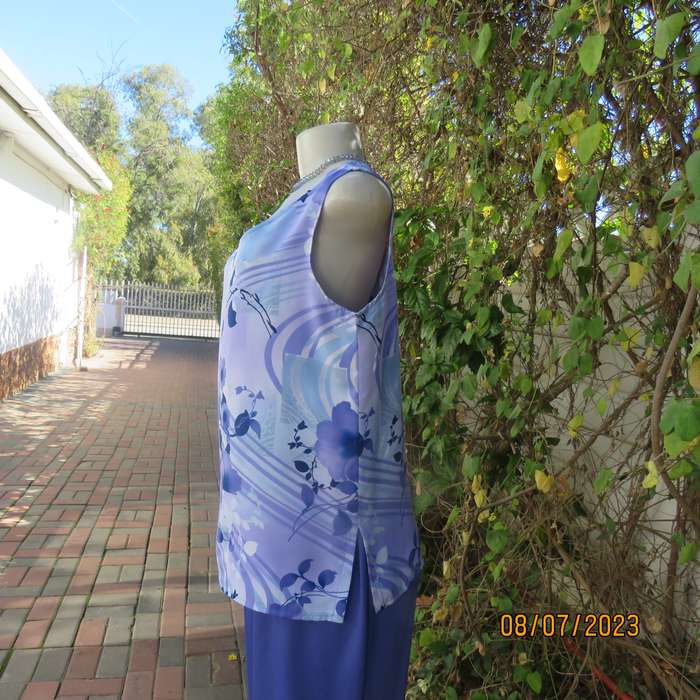 Boutique made sleeveless polyester top in medley of blue colours. Size 36