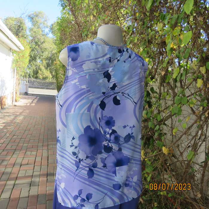 Boutique made sleeveless polyester top in medley of blue colours. Size 36