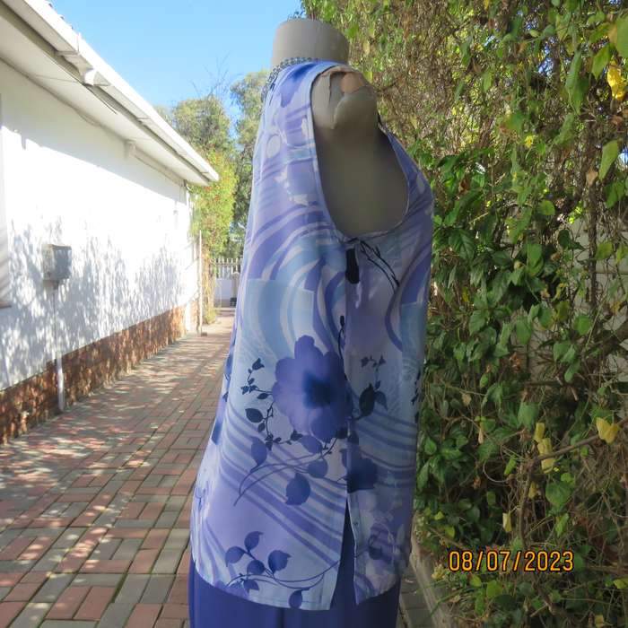 Boutique made sleeveless polyester top in medley of blue colours. Size 36
