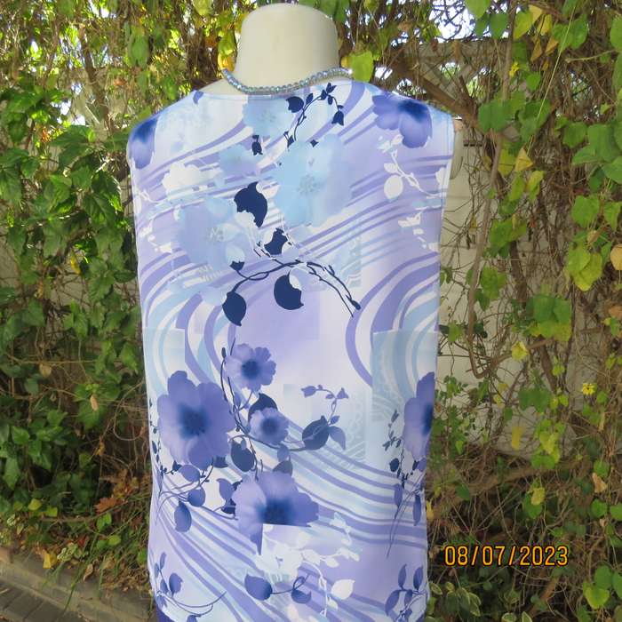 Boutique made sleeveless polyester top in medley of blue colours. Size 36