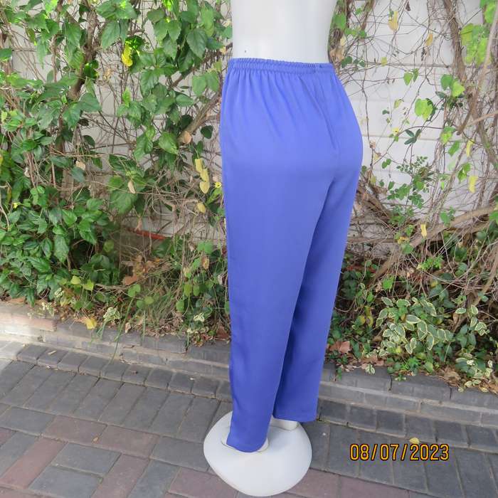 Indigo blue wide cut silky polyester pants size 42. Elasticated waist.