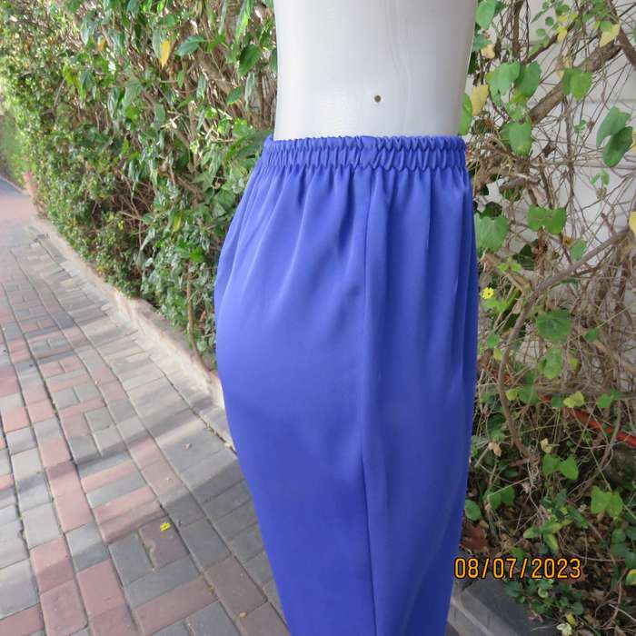 Indigo blue wide cut silky polyester pants size 42. Elasticated waist.