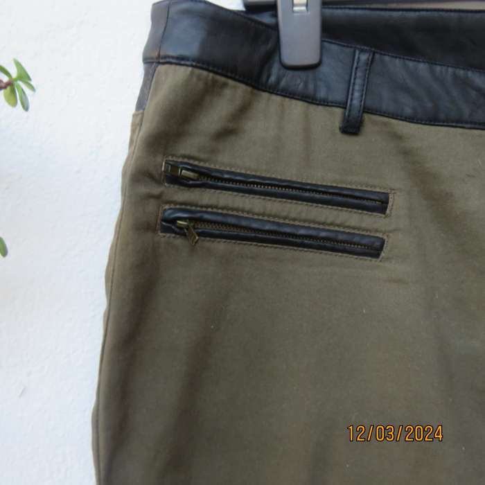 KELSO dark olive green skinny pants size 42 with black faux leather waistband.