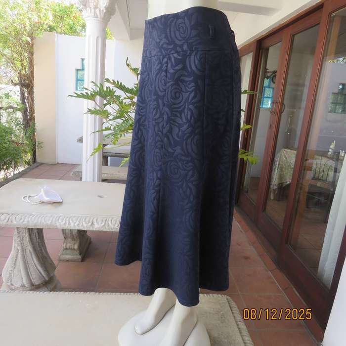 ROSSALINI navy paneled kick-out style skirt. Polyester with embossed flowers. Size 38