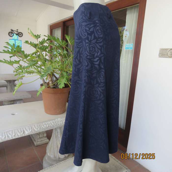 ROSSALINI navy paneled kick-out style skirt. Polyester with embossed flowers. Size 38