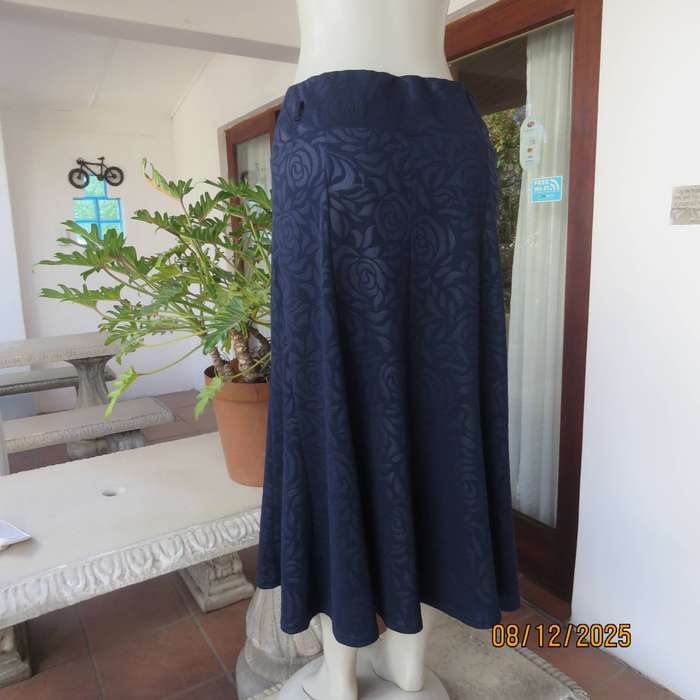 ROSSALINI navy paneled kick-out style skirt. Polyester with embossed flowers. Size 38