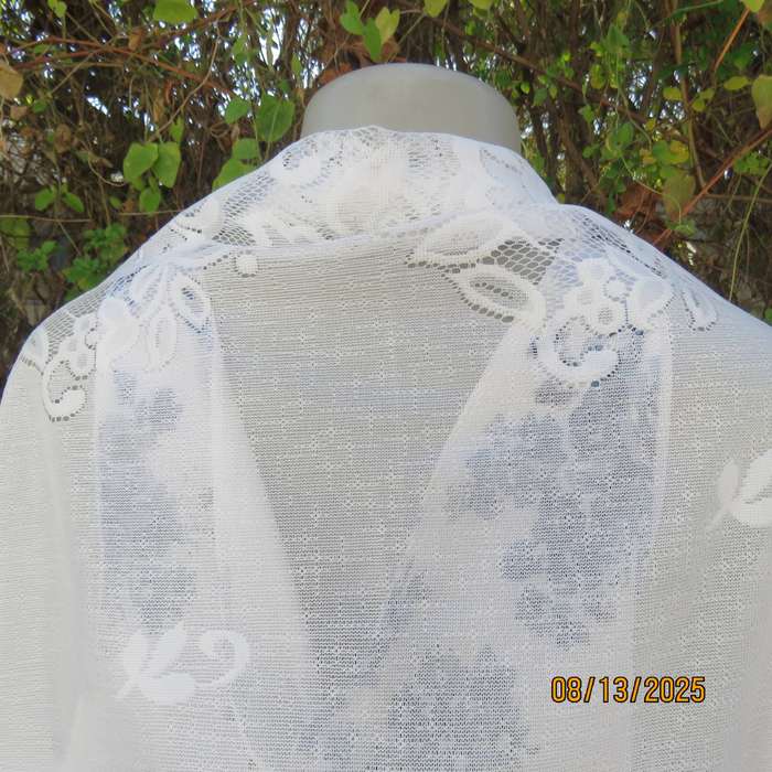 White sheer polyester triangle shawl with scalloped fringed edging. New