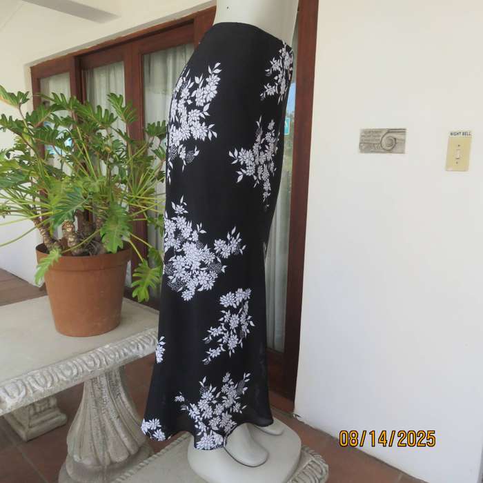 DONNA CLAIRE black sheer polyester with white floral posy print maxi skirt. Size 42