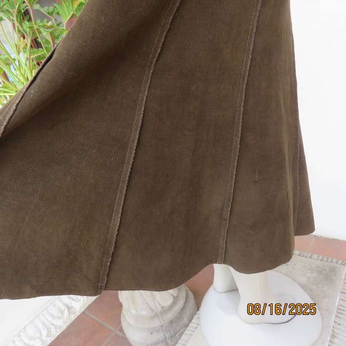 Choc brown a-line paneled corduroy skirt with elasticated waist. Size 42