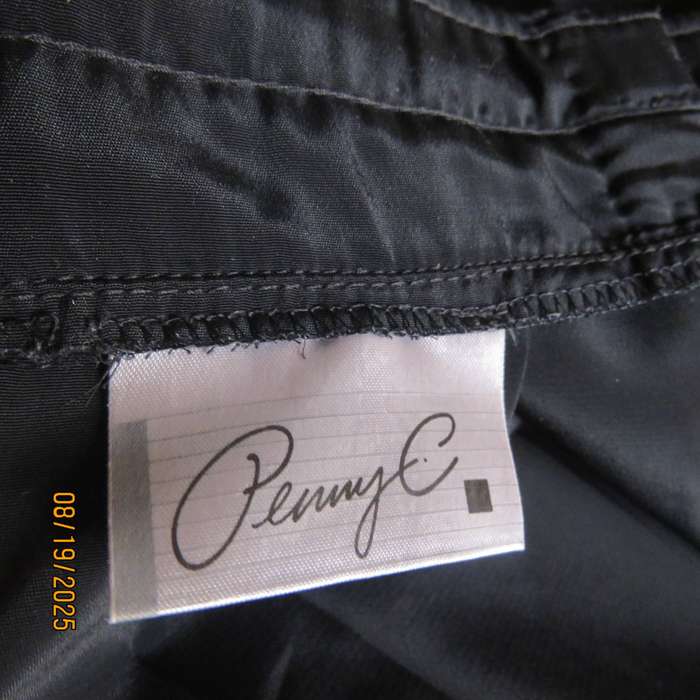 PENNY C black silky polyester skirt. Wide yoked front with pleats. Size 42.