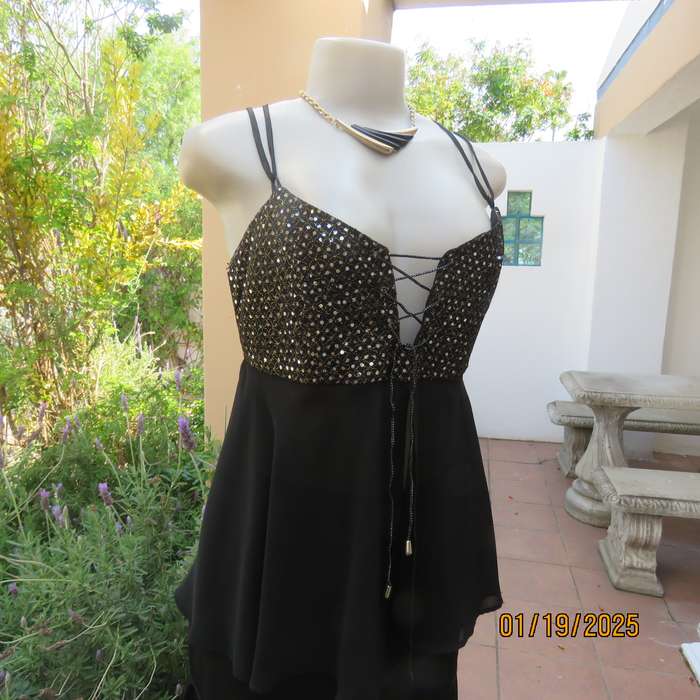 Sexy black polyester evening top with sequined bodice.Empire style. Size 34.Shoulder straps.As new