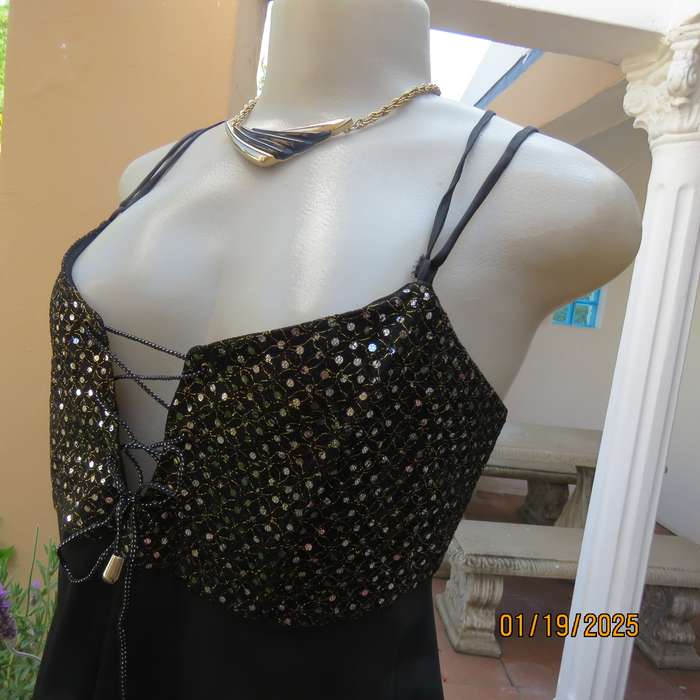 Sexy black polyester evening top with sequined bodice.Empire style. Size 34.Shoulder straps.As new