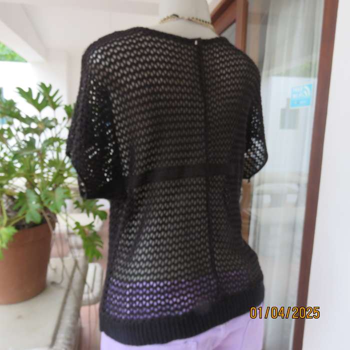 Charming black cotton knit slip over top with tiny knit-on sleeves. Size 36.