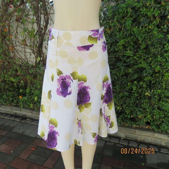 White polycotton paneled A-line skirt with purple-green bold flowers. Size 34-36