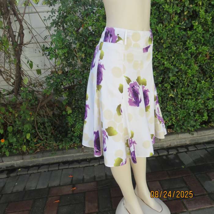 White polycotton paneled A-line skirt with purple-green bold flowers. Size 34-36