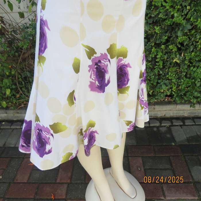 White polycotton paneled A-line skirt with purple-green bold flowers. Size 34-36