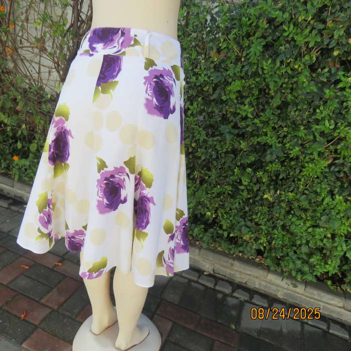 White polycotton paneled A-line skirt with purple-green bold flowers. Size 34-36