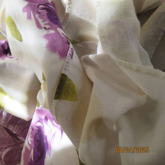 White polycotton paneled A-line skirt with purple-green bold flowers. Size 34-36