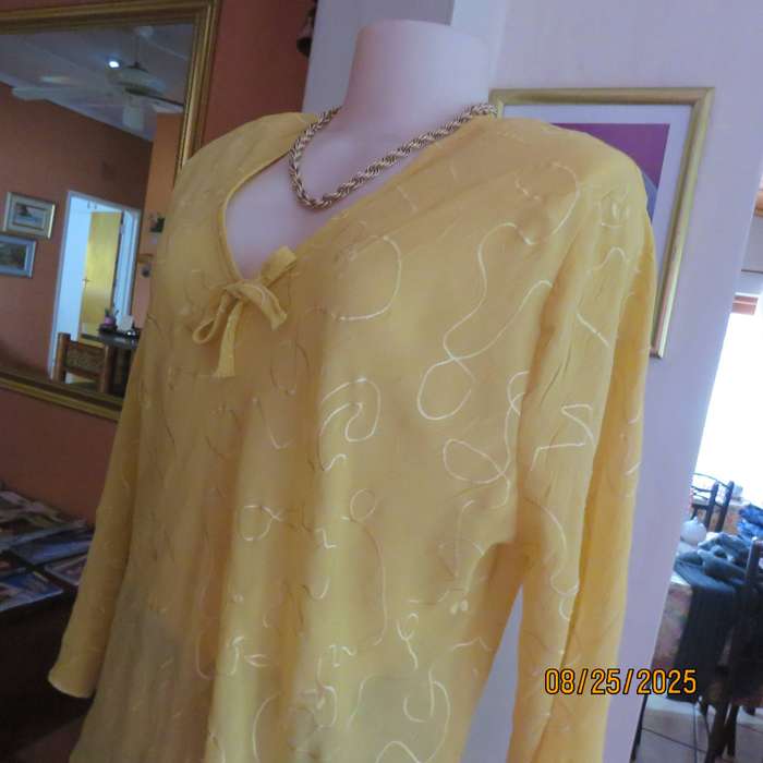 Golden yellow slightly creased embroidered polyester long top. Size 40