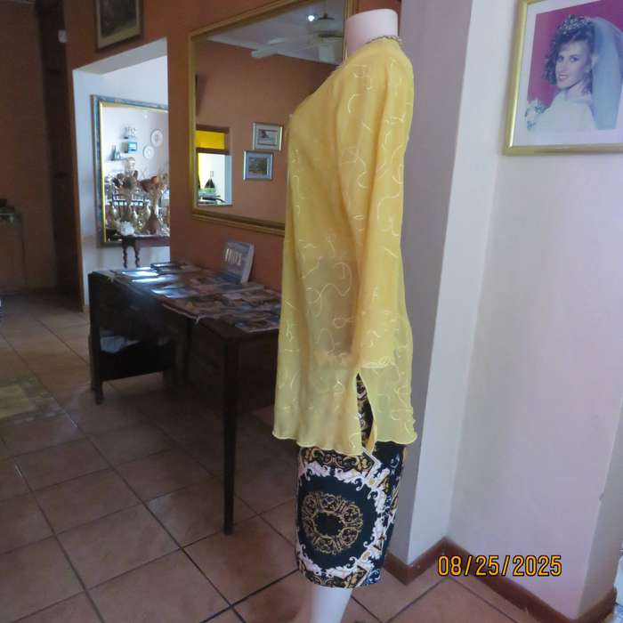Golden yellow slightly creased embroidered polyester long top. Size 40