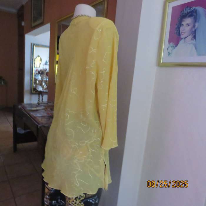 Golden yellow slightly creased embroidered polyester long top. Size 40