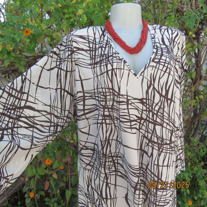 DONNA Claire rich cream slip over V neck top with brown graphic print. Size 48