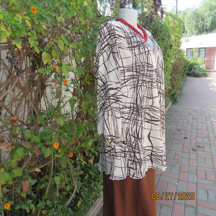 DONNA Claire rich cream slip over V neck top with brown graphic print. Size 48