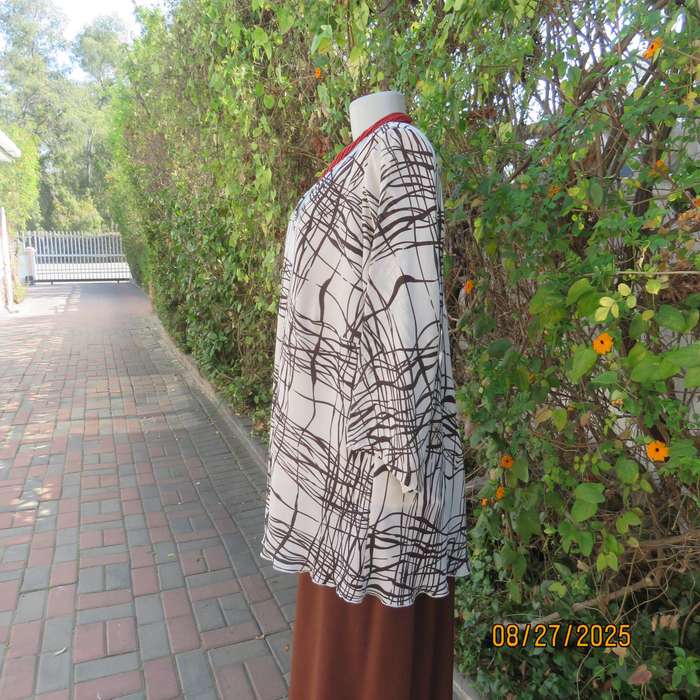 DONNA Claire rich cream slip over V neck top with brown graphic print. Size 48