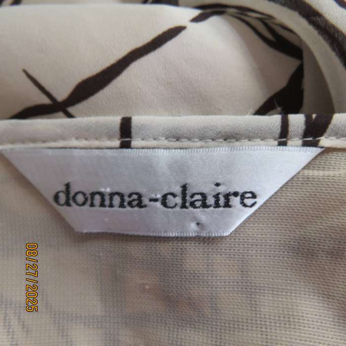 DONNA Claire rich cream slip over V neck top with brown graphic print. Size 48