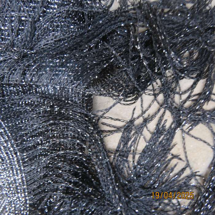 Luxury black polyester throw with silver thread with V front. New item