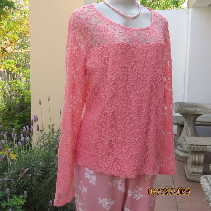 Salmon pink nylon floral lace long sleeve top with polyester stretch front lining. Size 38-40