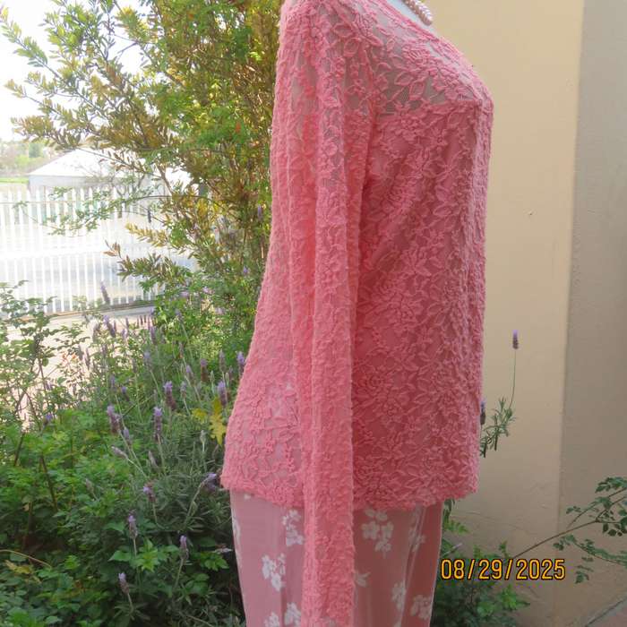 Salmon pink nylon floral lace long sleeve top with polyester stretch front lining. Size 38-40