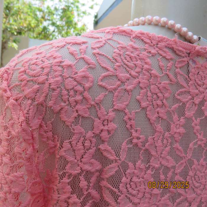 Salmon pink nylon floral lace long sleeve top with polyester stretch front lining. Size 38-40