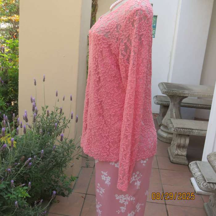 Salmon pink nylon floral lace long sleeve top with polyester stretch front lining. Size 38-40