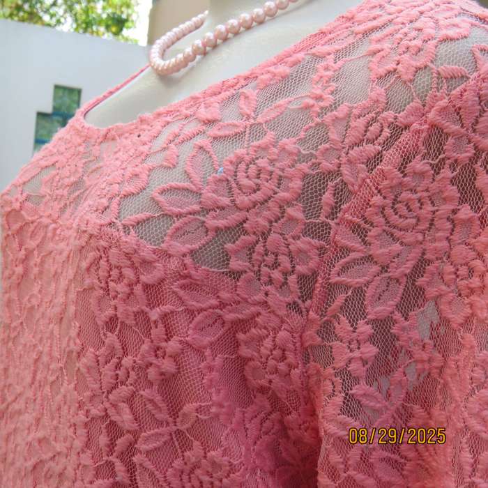 Salmon pink nylon floral lace long sleeve top with polyester stretch front lining. Size 38-40