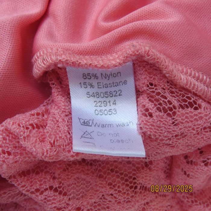 Salmon pink nylon floral lace long sleeve top with polyester stretch front lining. Size 38-40