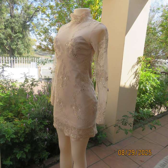 Gold colour richly embroidered mini dress in satin and sheer fabric. Size 30-32