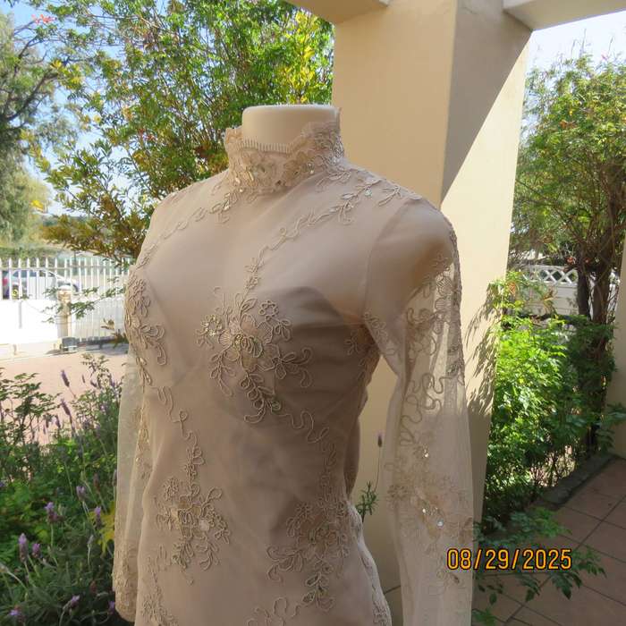Gold colour richly embroidered mini dress in satin and sheer fabric. Size 30-32