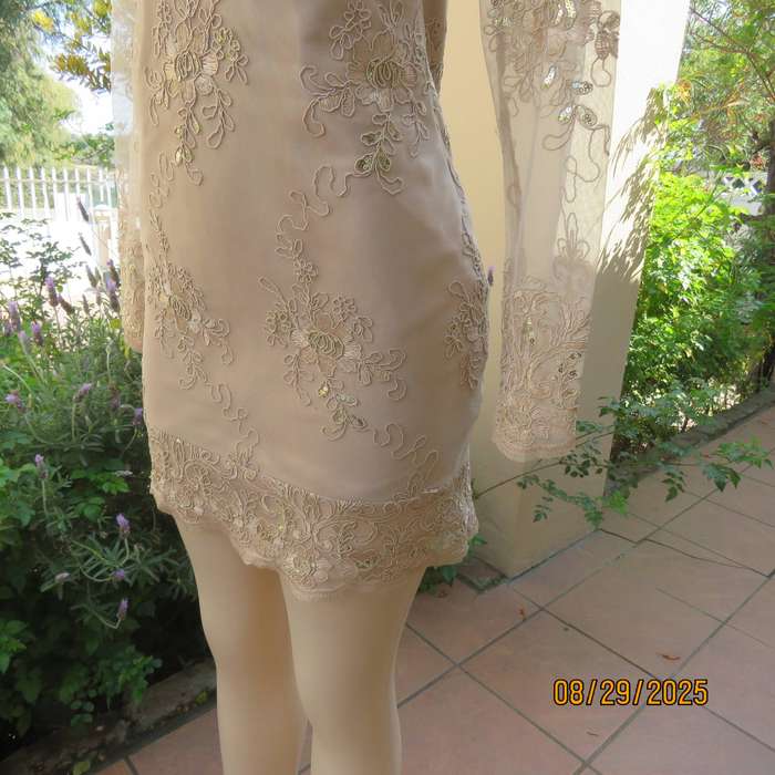 Gold colour richly embroidered mini dress in satin and sheer fabric. Size 30-32